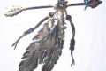 metal art design idea with arrow and feathers
